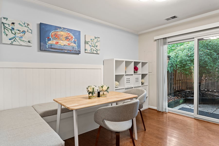 cute built in bench seating in the dining area with views of the beautiful backyard.