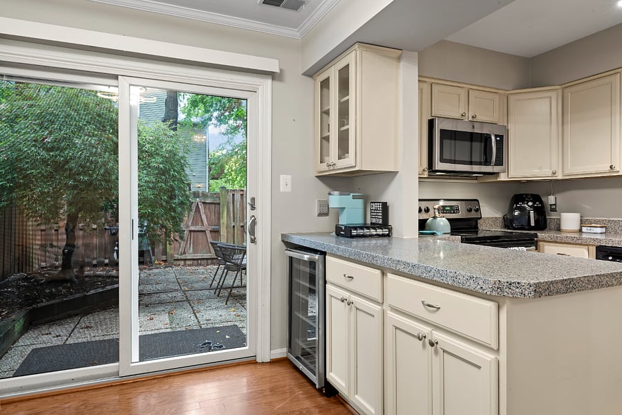 updated kitchen with stainless steel appliances, granite counter tops, and wine cooler and coffee corner