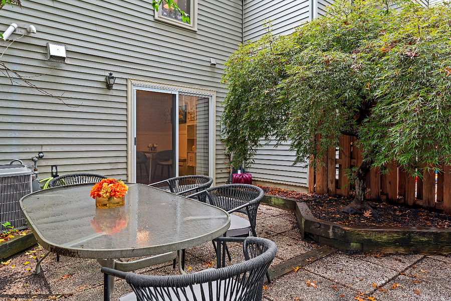 inviting and private backyard w/bbq grill and perfect for dining al fresco.