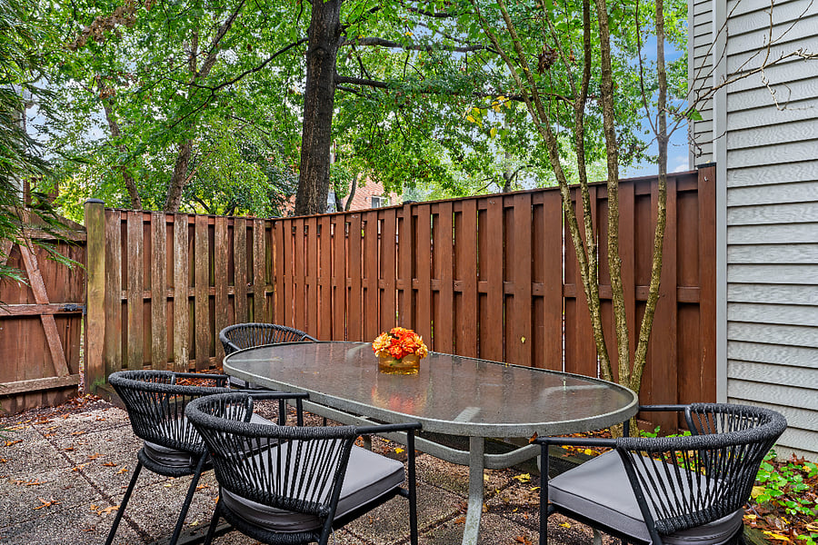 inviting and private backyard w/bbq grill and perfect for dining al fresco.