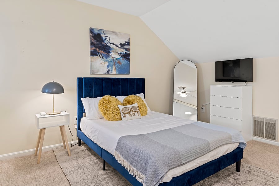 Cozy full size 3rd bed with smart TV located on 3rd floor loft.