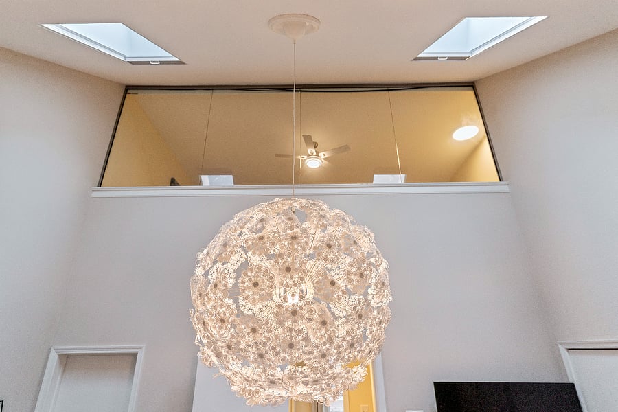 unique light fixture in the primary bedroom