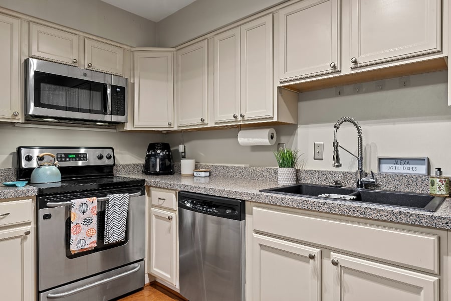 Fully Stocked Kitchen with stainless steel appliances.