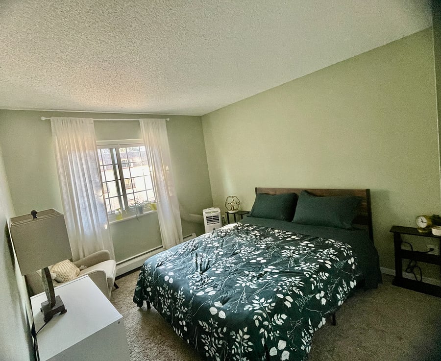 Queen memory foam bed with small dresser and large closet