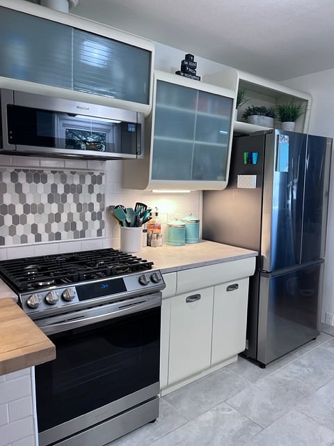 Stainless steel gas range, microwave and refrigerator