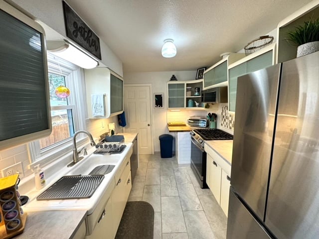 Mid-Century Modern kitchen with full size stainless steel appliances