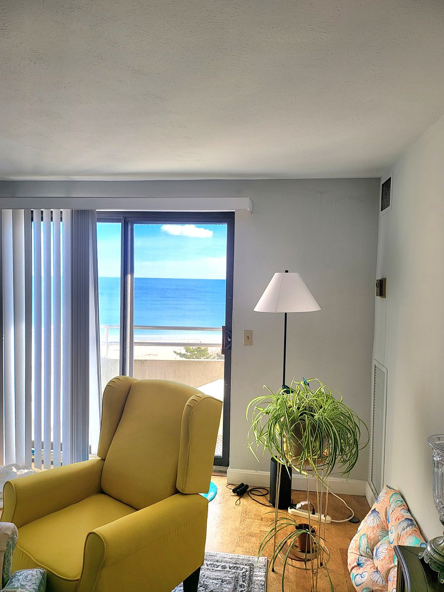 Ocean facing open living room/dinning room with direct ocean facing balcony