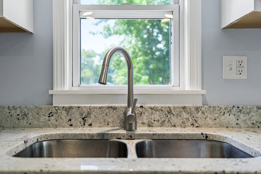 Kitchen with view of fenced in backyard