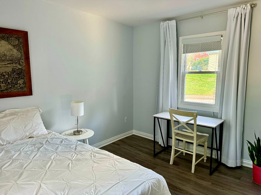 Bedroom #1 with full size bed + designated workspace