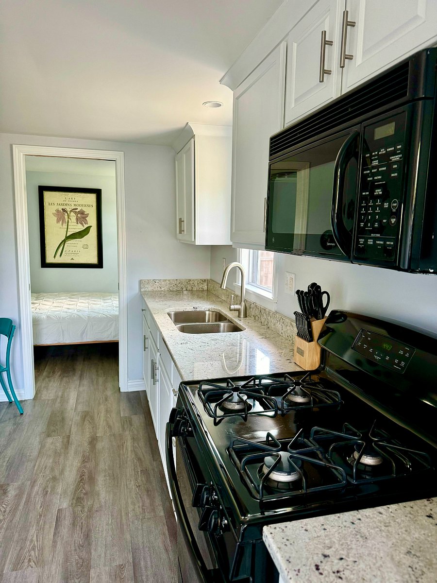 Kitchen with granite countertops & gas stove