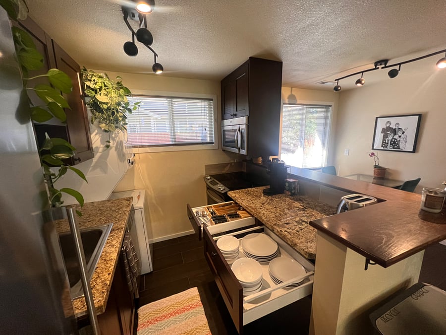 Dishes, silverware, cooking utensils, Keurig coffee maker, toaster, pots and pans, cutting boards, microwave, etc.