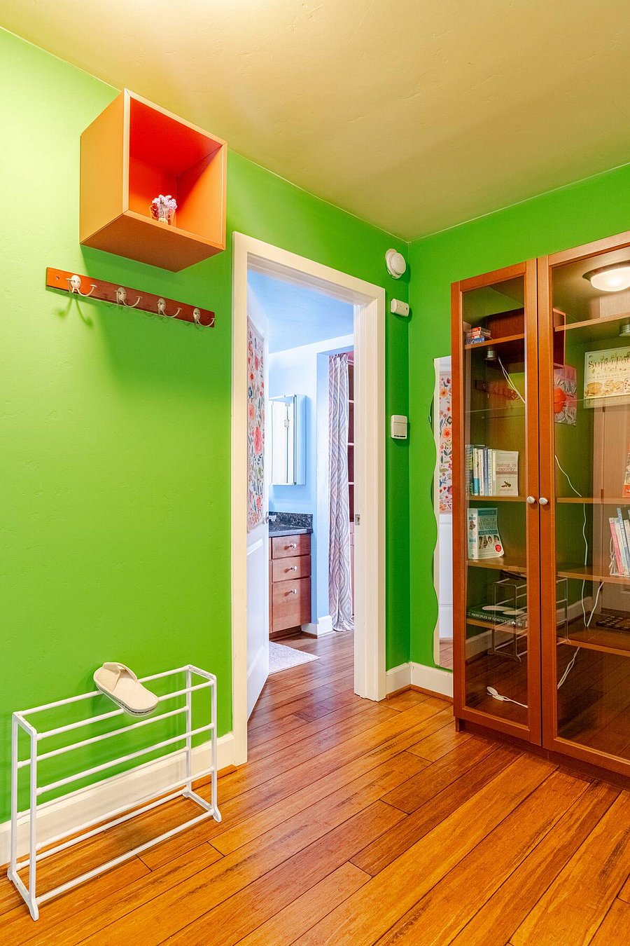 Dining Area - bookshelves & bathroom entrance.