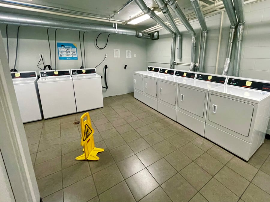 One of laundry rooms with plenty of washers and dryers.