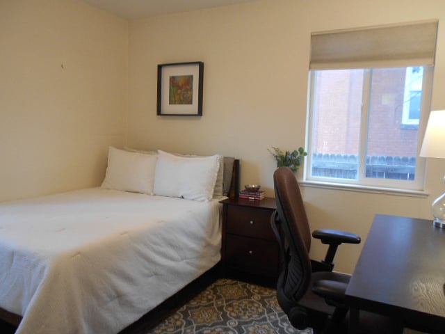 Secondary bedroom features a full bed with new mattress, disk, chair and lighting for working from home