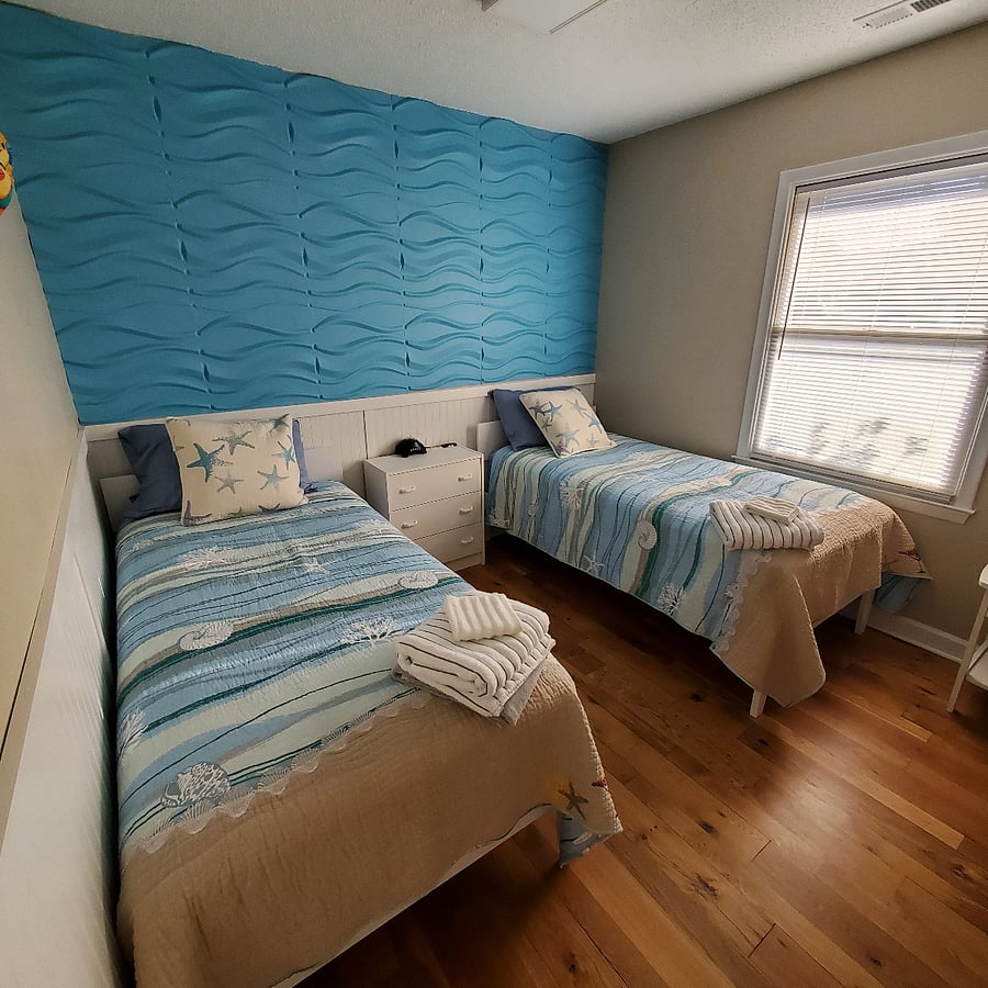 TWIN room has (2) twin beds, 2 lockers, and floor pillows. Laser light is great for bringing a relaxing night sky indoors.