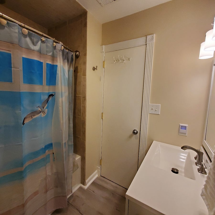 Ensuite bathroom off King bedroom. Spa shower head in tiled shower with jetted tub (not hot tub),