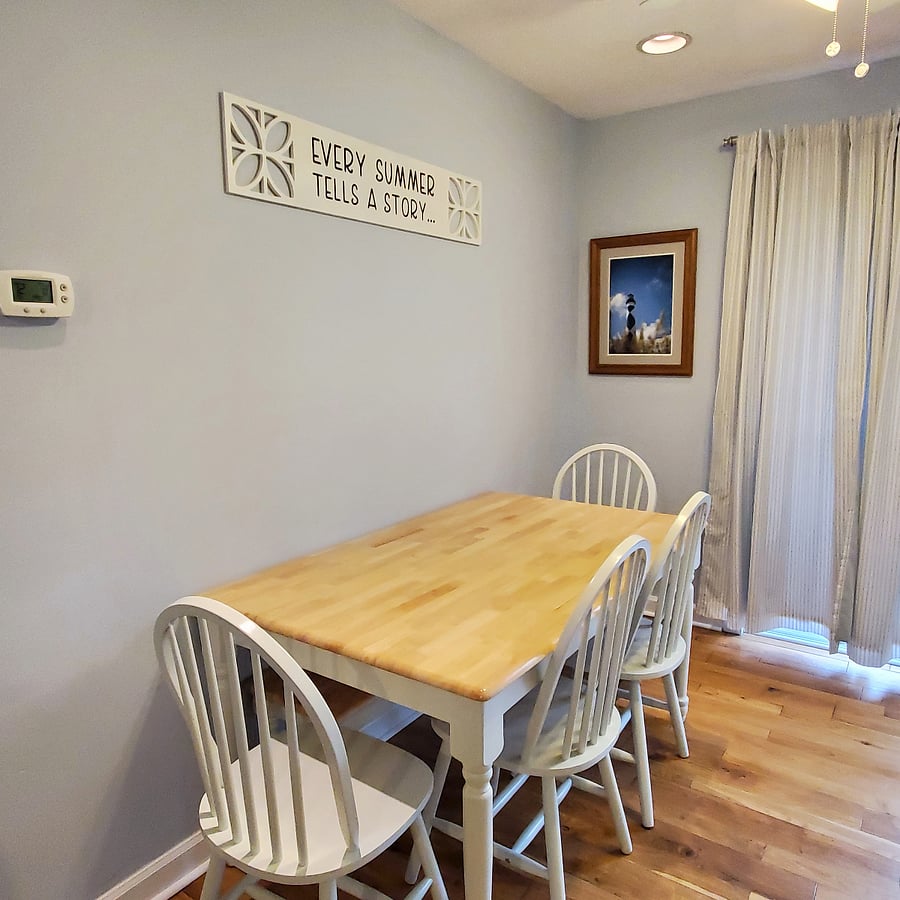 Dining table with 4 chairs and bench seat is right beside a sliding glass door. Let in the sunshine or use the curtains (medium light blackout) to block out the world. A nice deck with built-in seating, small table and Adirondack is just steps away. Feel like grilling out? We've got you covered!