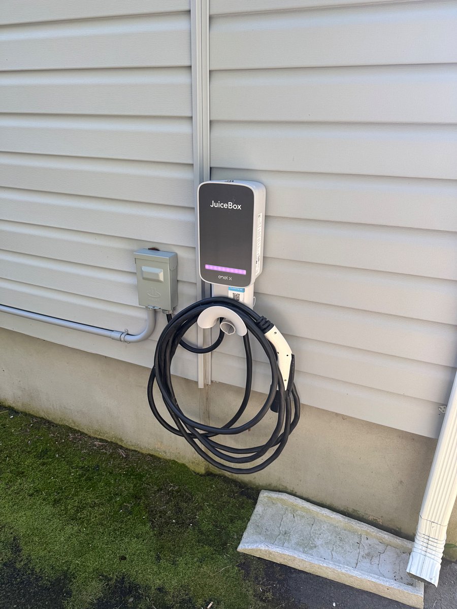 Level 2 EV charger in driveway