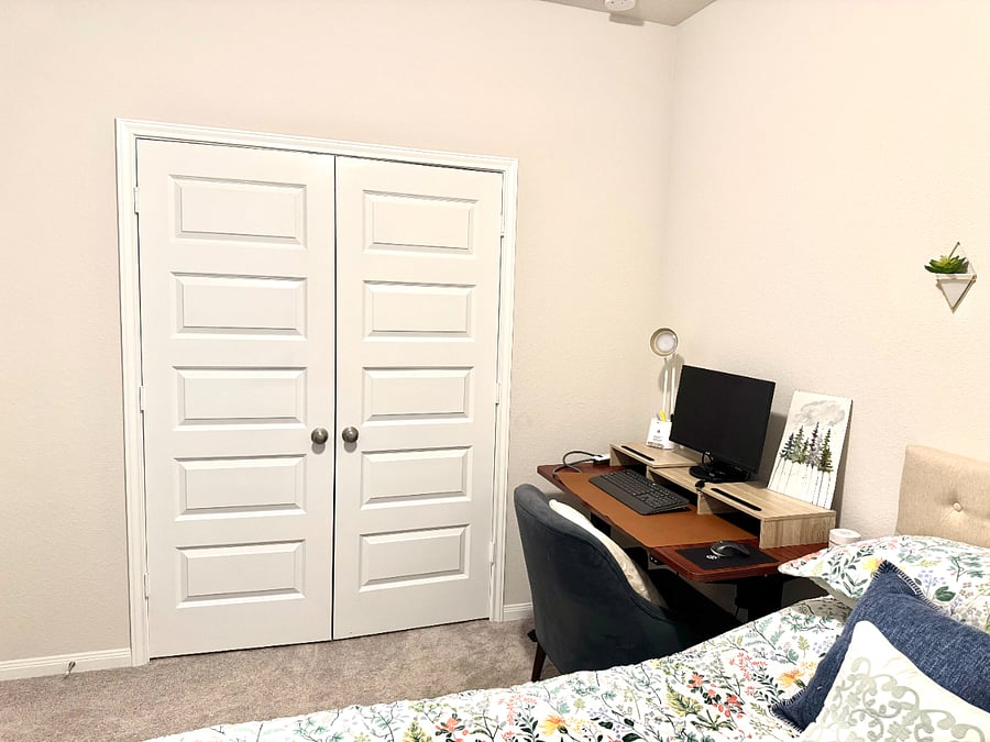 Bedroom 1 with workspace and queen bed