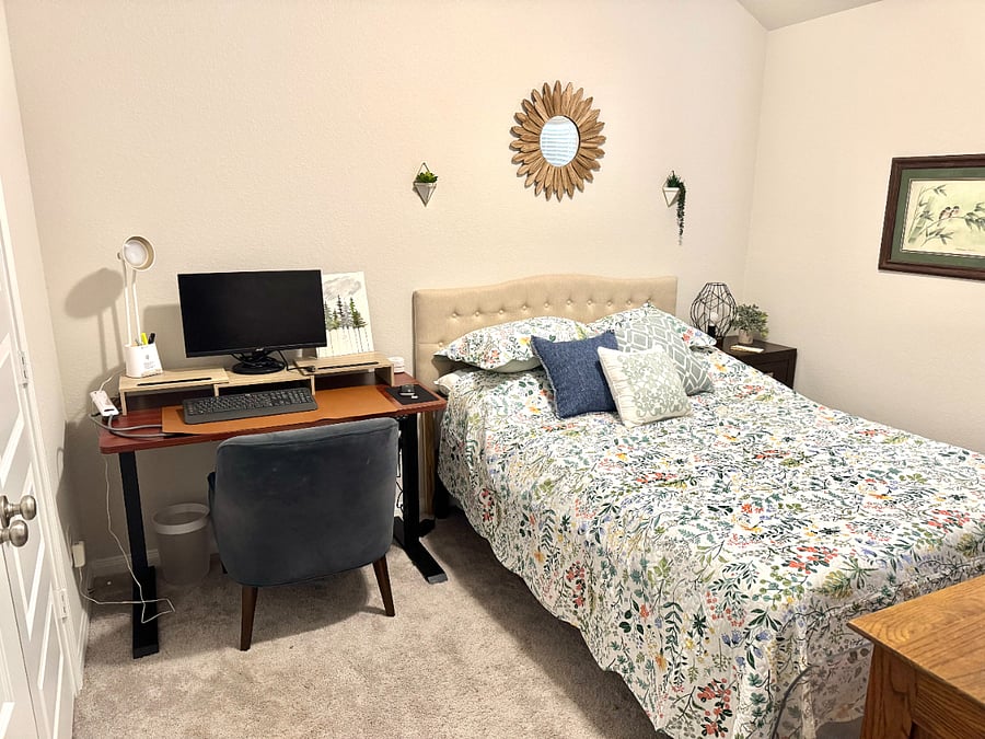 Bedroom 1 with workspace and queen bed