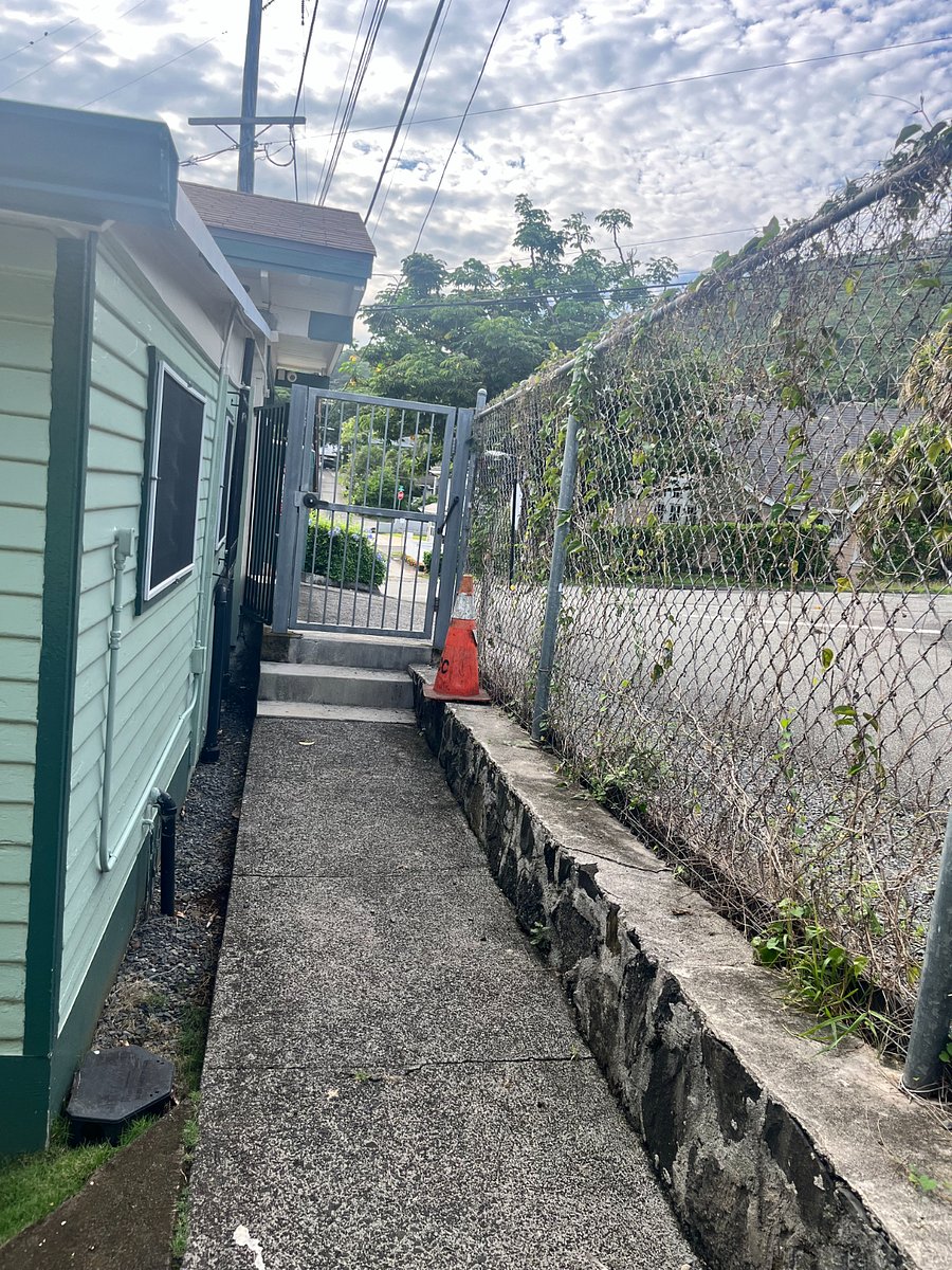 Gated entrance with street parking.