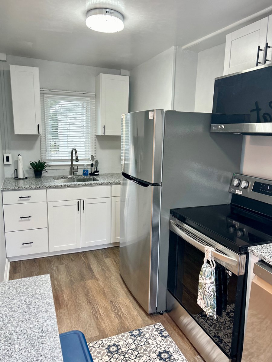 Kitchen with full sized refrigerator, stove, dishwasher and dine in area