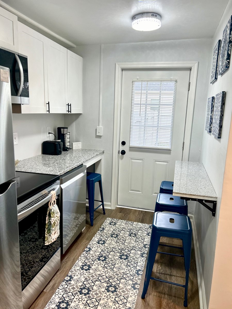 Kitchen with collapsible counter area and outdoor patio access