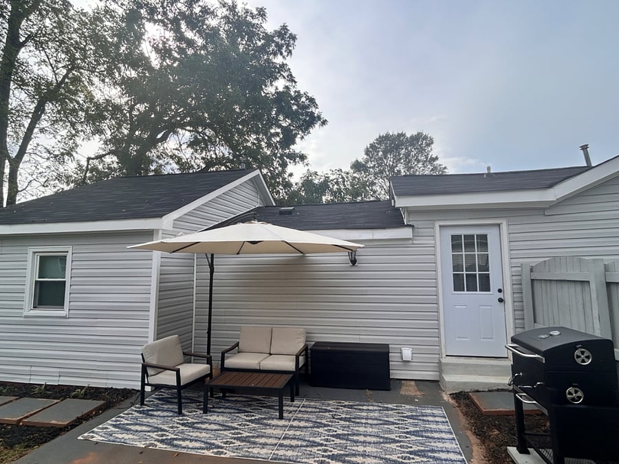 Relaxing private patio space with grill and shade