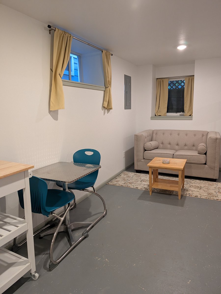 Seating area, couch, coffee table.