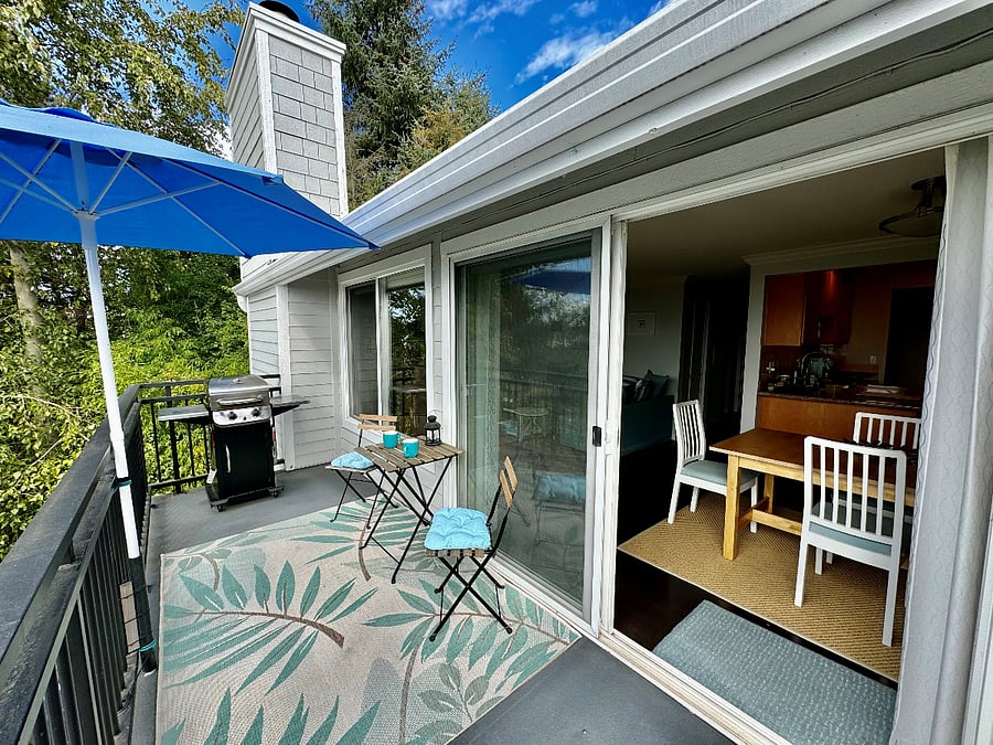 Cozy balcony with a grill and spectacular lake views.