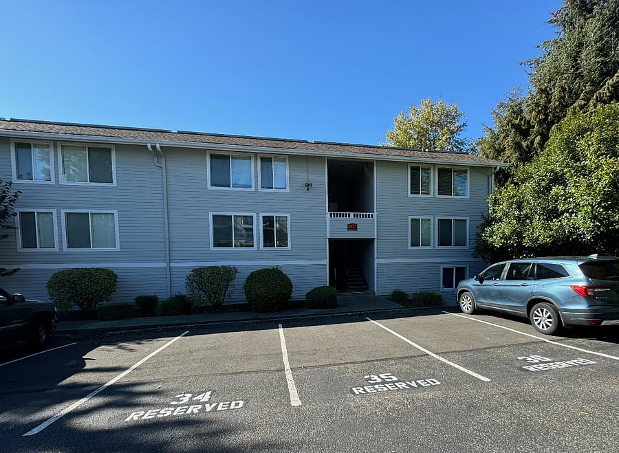 Building exterior with dedicated parking.