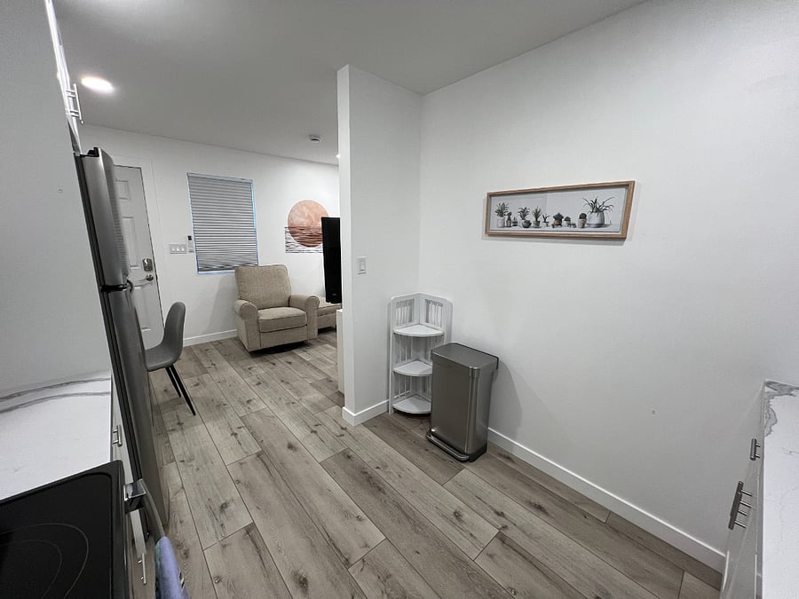 View from the kitchen. Additional storage and trash bin with plenty of extra bags.