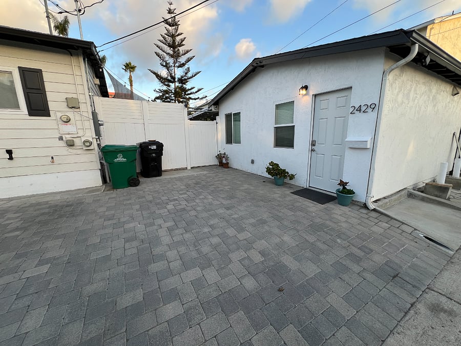 View of the front of the unit and parking space.