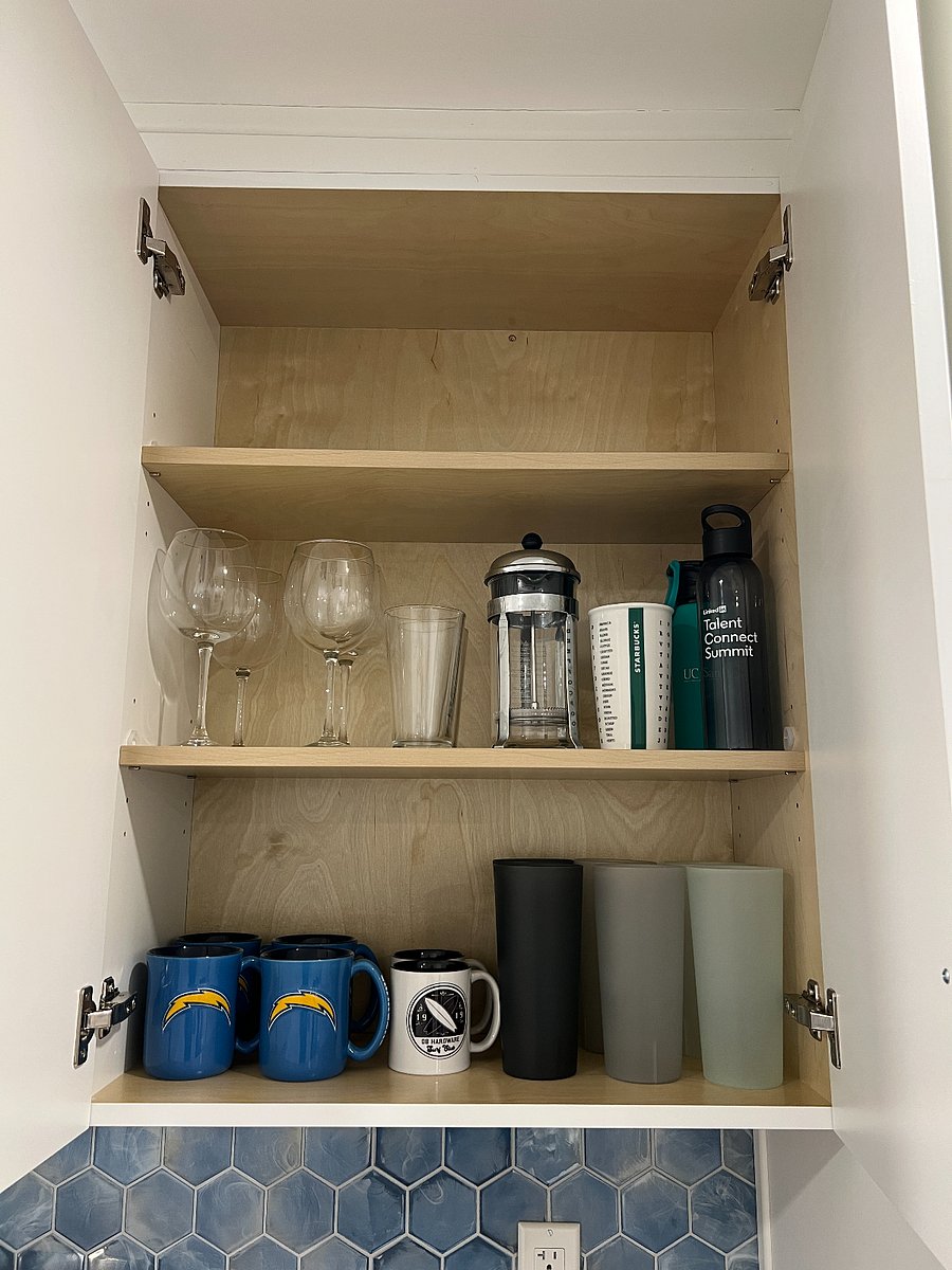 Cups, mugs, wine glasses, and a French press.