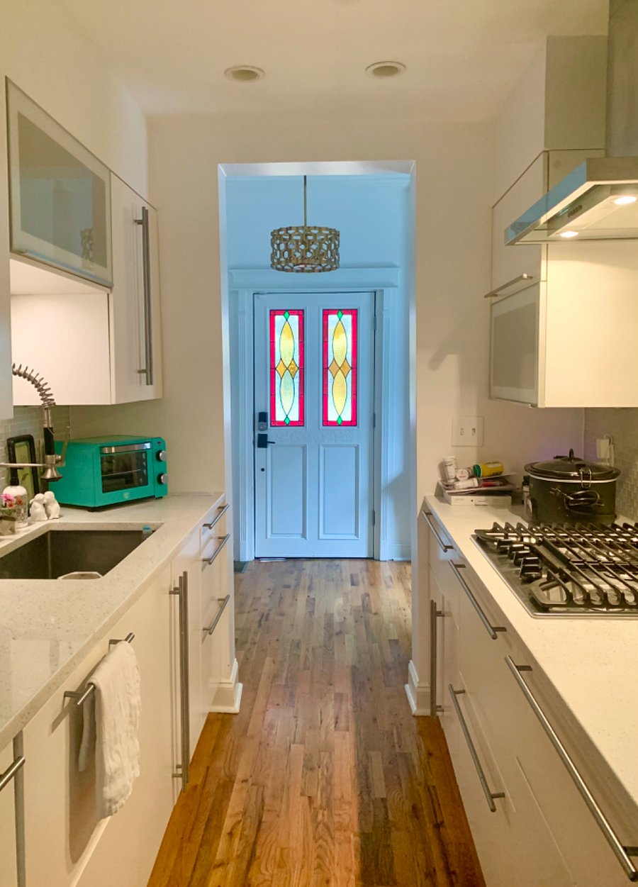 The house is equipped with a small, galley kitchen.