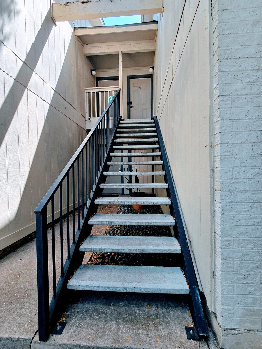 Exterior stairs, unit is at the top of the stairs on the left.
