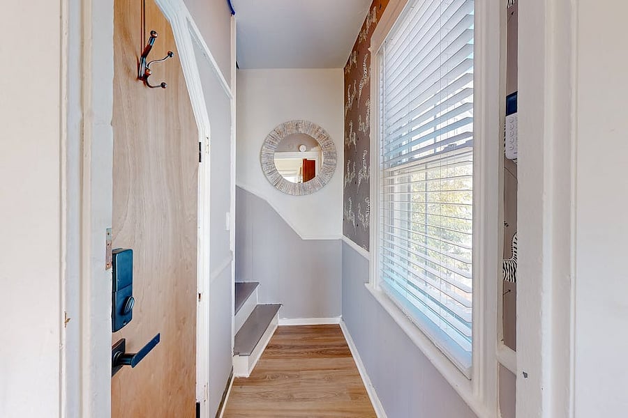 Back hall entrance and stairwell to 2nd floor