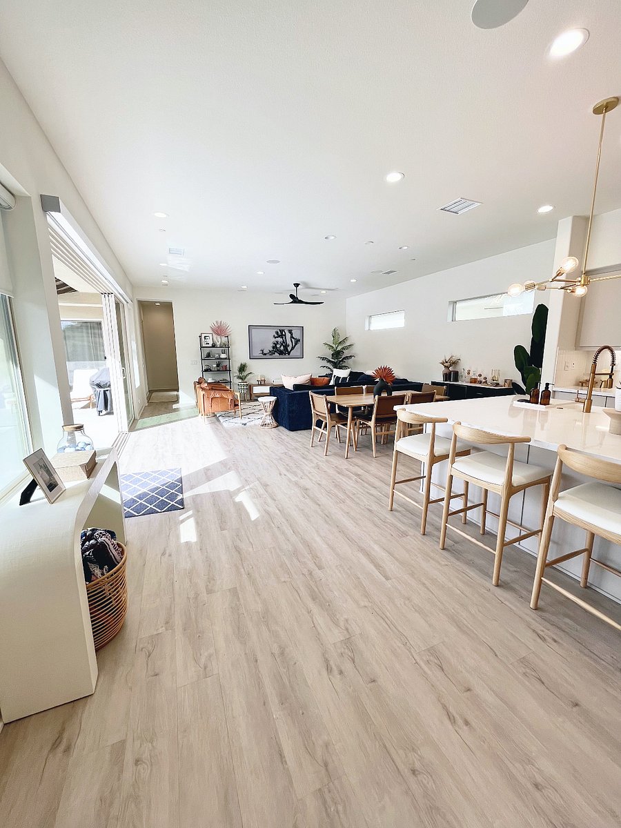 Front area of house- kitchen and living which leads to the outside with large stacking doors. 