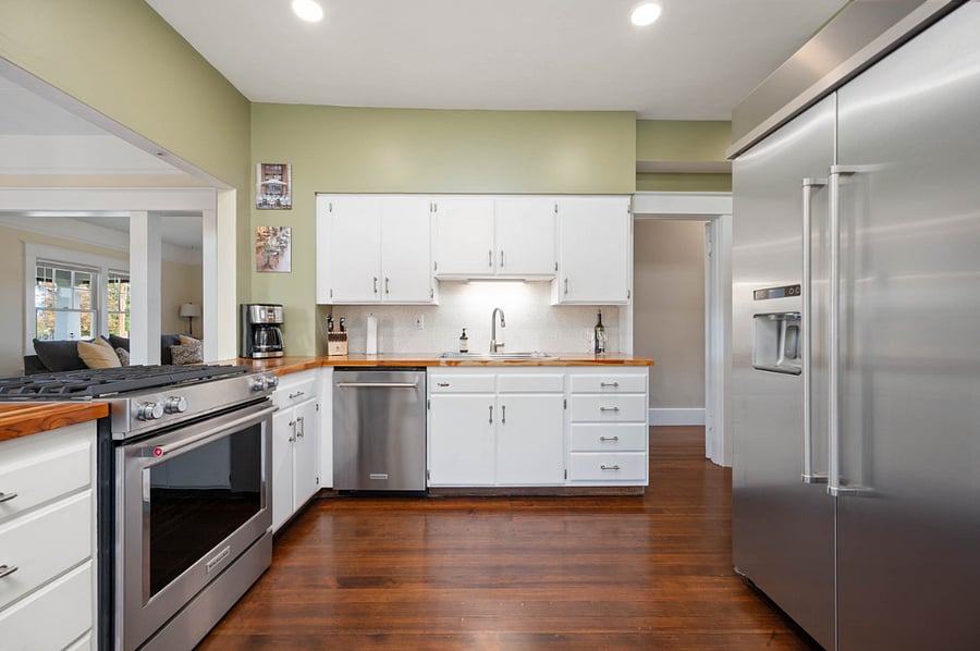 Fully stocked kitchen with stainless steel appliances. Recessed lighting.