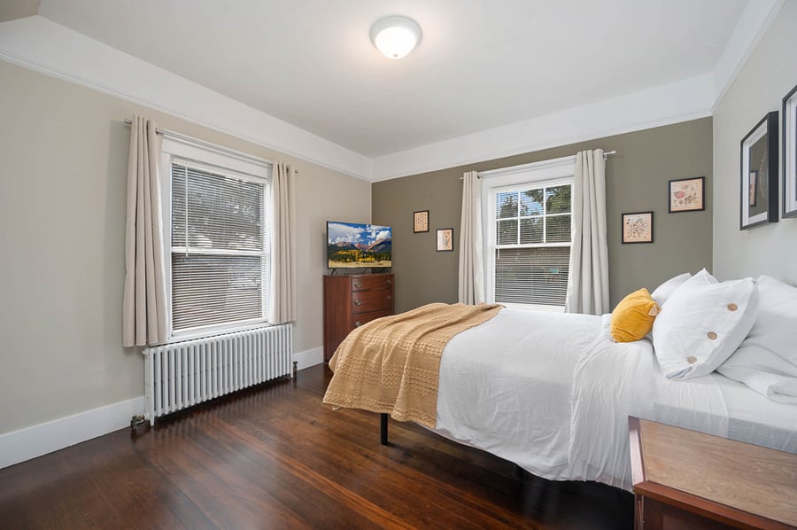 3rd bedroom on main floor. Queen size bed. Blackout curtains.