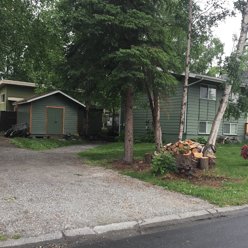Private parking for tenants.  Tenant door is around the left side. Part of the1st floor of the main house and behind is the apartment.
