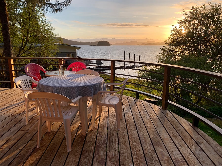 Deck with furniture to sit and enjoy surroundings a meal or some quiet time.