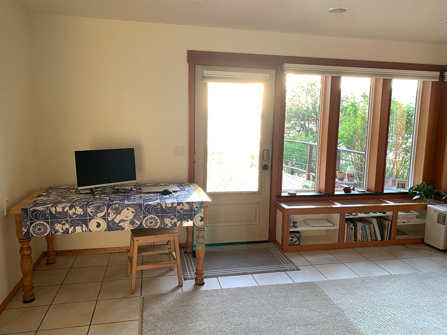 Dining table and smart T.V. on wall behind monitor not pictured. I see this as a great spot to work, or dine.