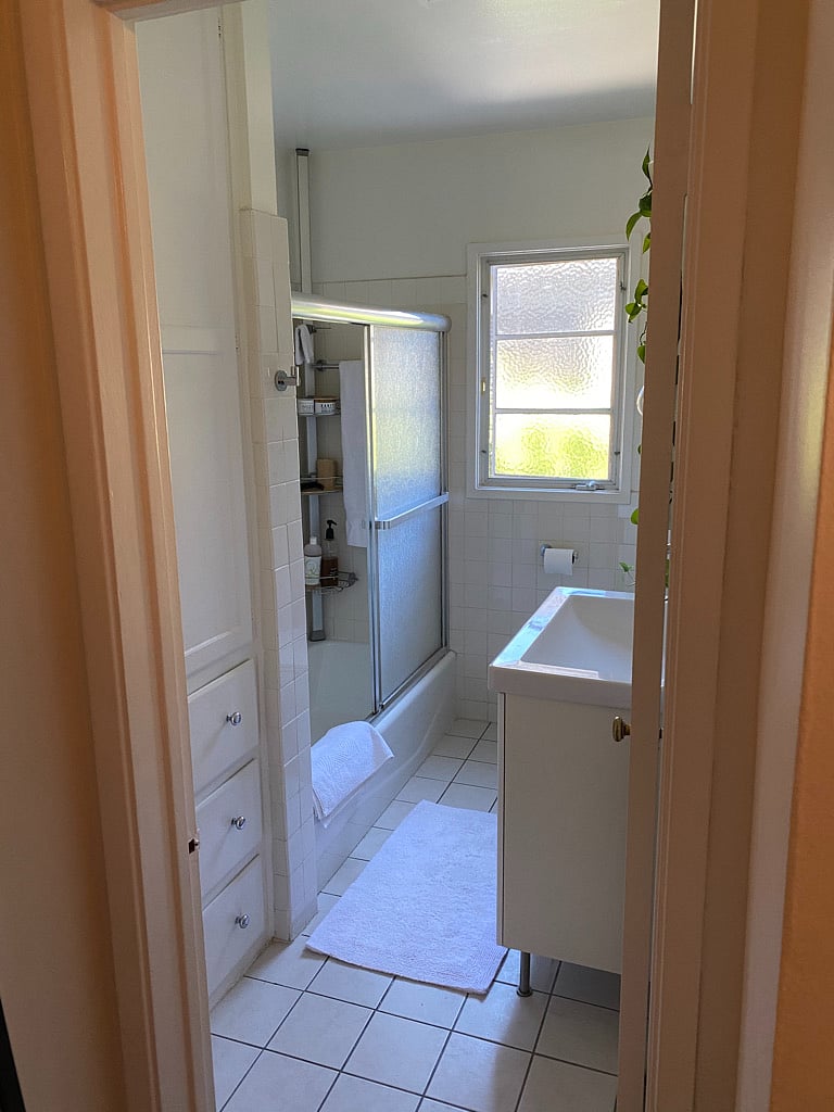 Bathroom with great water pressure, bath and shower.  Window open to your private side patio.