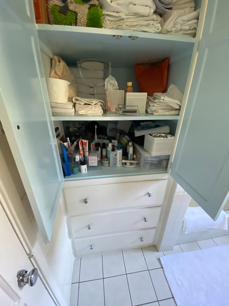 Bathroom storage includes shelving and four drawers 