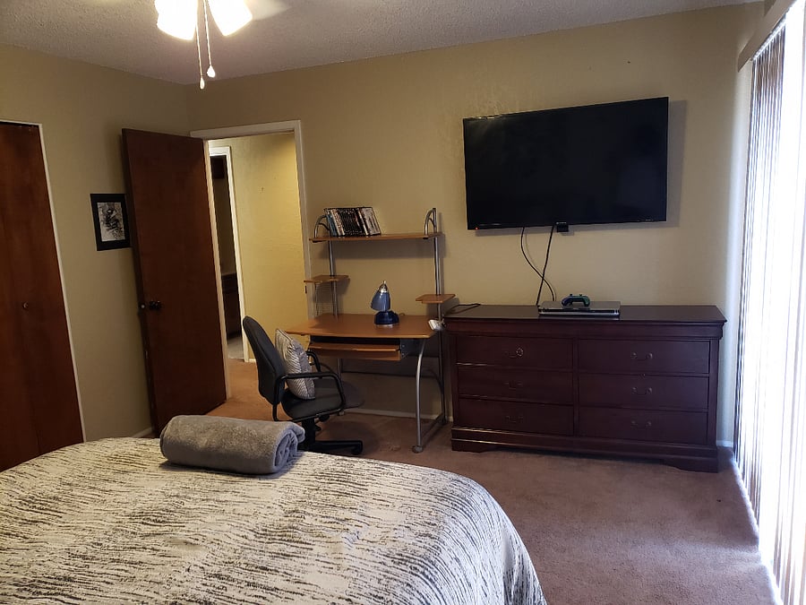 The balcony bedroom features a wide screen TV and DVD player.