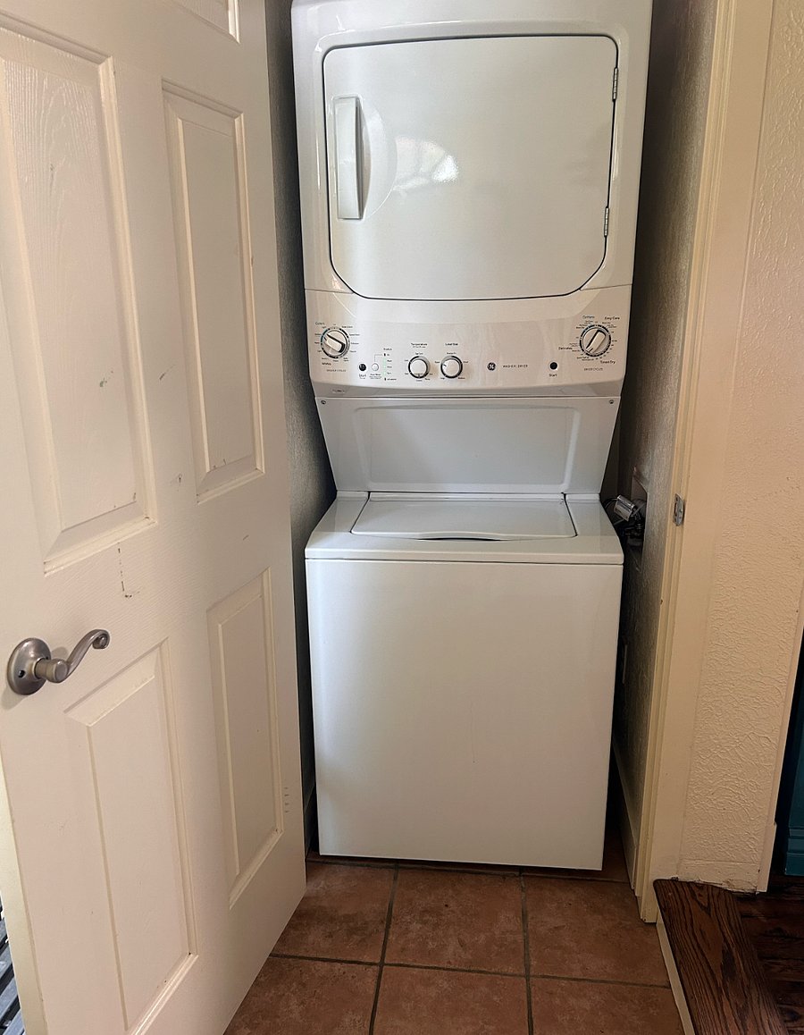 Washer and dryer in the back door mud room.