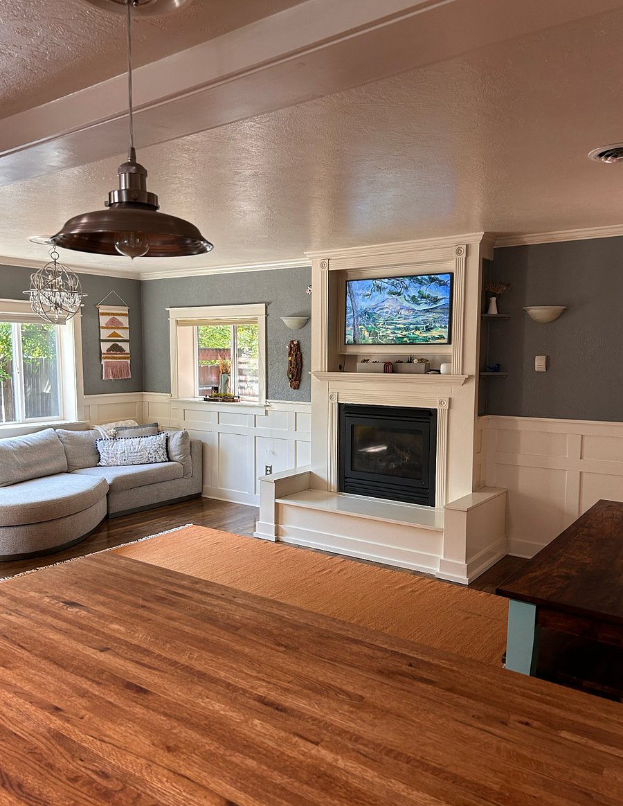 The living room has a Samsung Frame smart TV and a gas fireplace (flip a switch to turn it on/off).