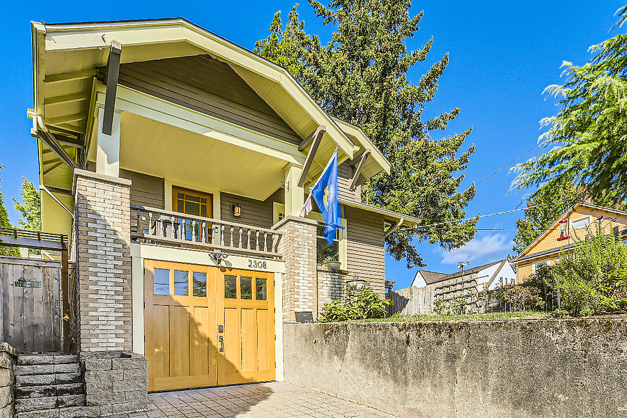 Front of the whole house. The apartment entrance is through the gate on the left of the garage.