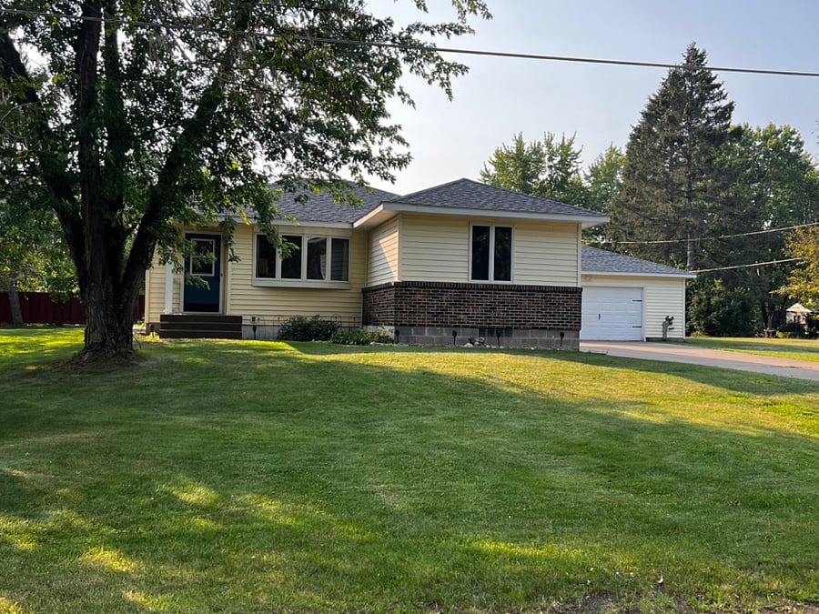Front of house, driveway and garage